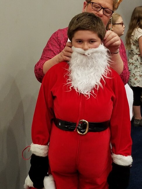Kid dressed as Santa