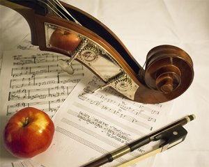 An apple on sheet music