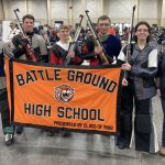 BGHS students with air rifles and banner