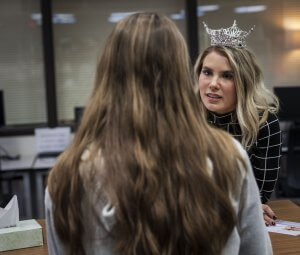 Miss Washington, Vanessa Munson, talks with a student at Prairie High School