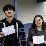 John Ong (left) and Hana Feldheger with their National Merit Scholarship finalist certificates